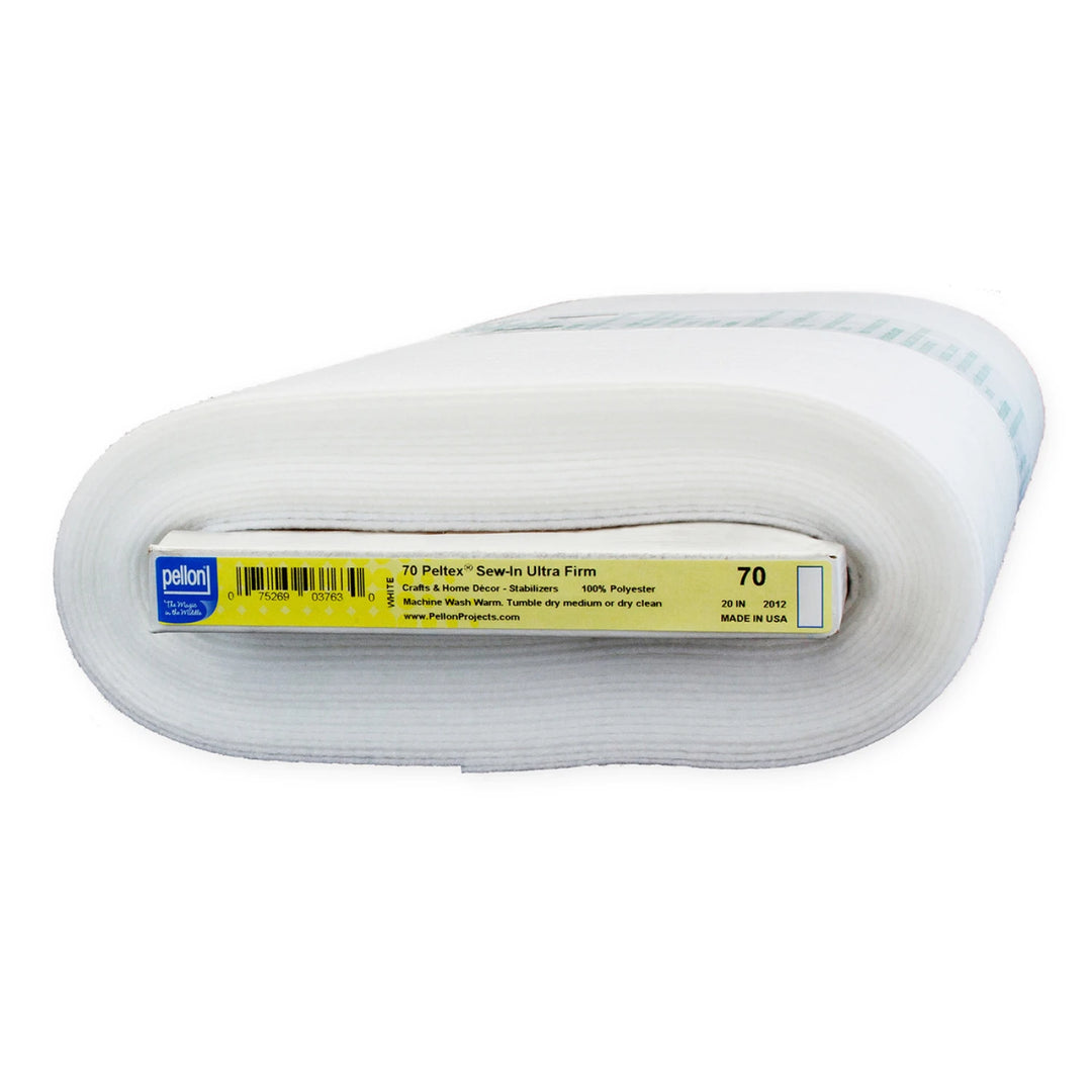 Rolled white Pellon Peltex 70 Sew-In Ultra Firm Stabilizer used for providing structure and firmness in sewing, quilting, and modern needlework projects.