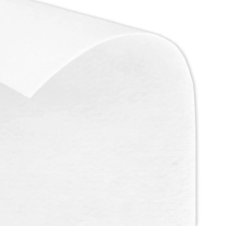 Close-up of white fabric stabilizer with a slightly curved edge, showcasing the texture of Pellon Peltex 70 Sew-In Ultra Firm Stabilizer used for firm support in embroidery and sewing projects.