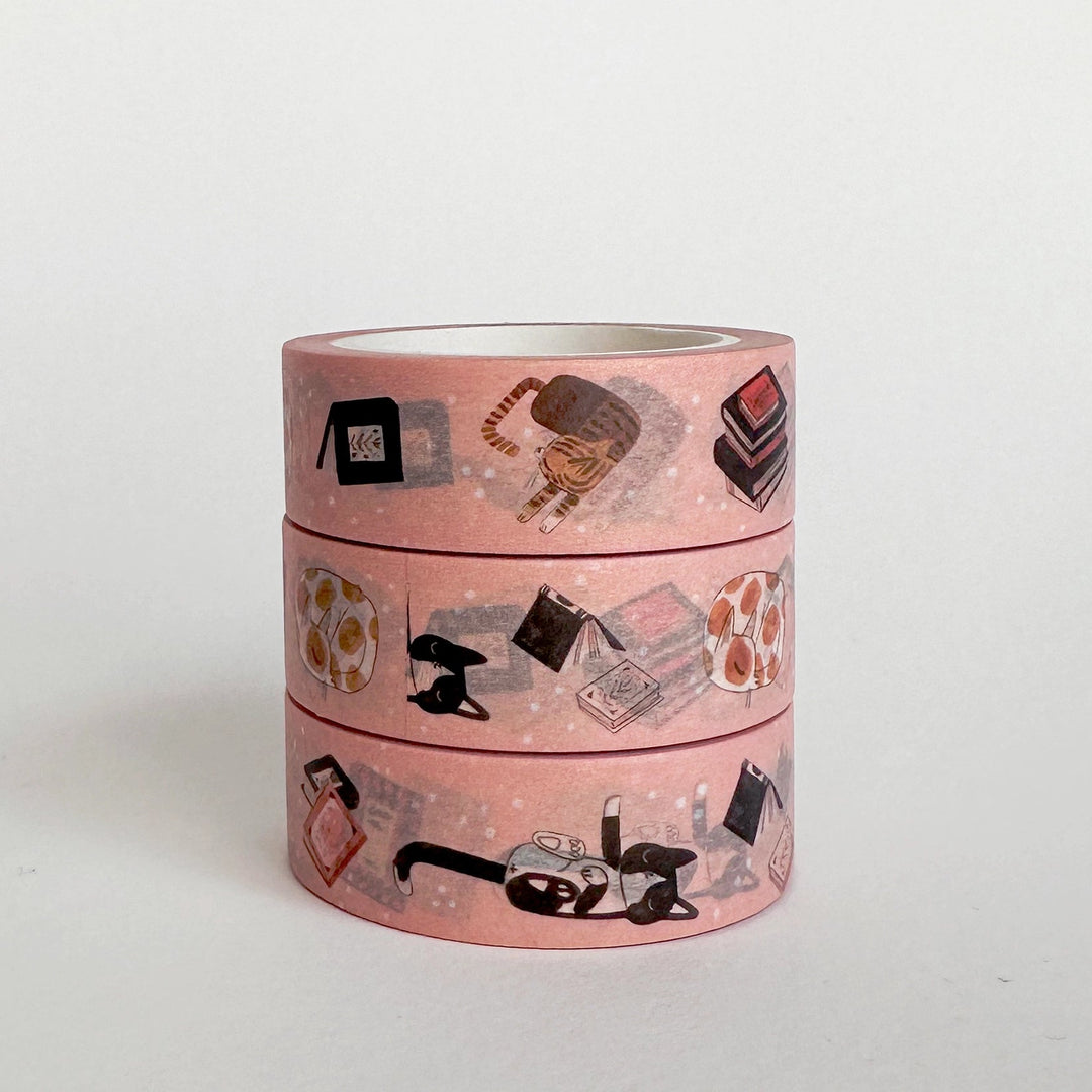 Three rolls of pink washi tape with various illustrations on a white background