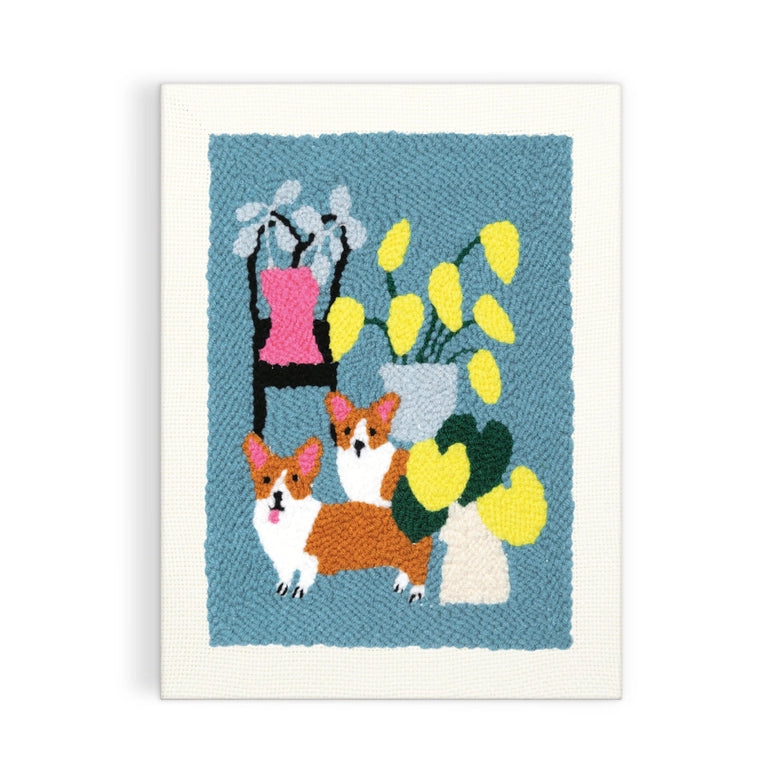 Corgi Friends Punch Needle Kit featuring a colorful punch needle design of two corgis with potted yellow and white flowers on a textured blue background, perfect for modern needlework enthusiasts.