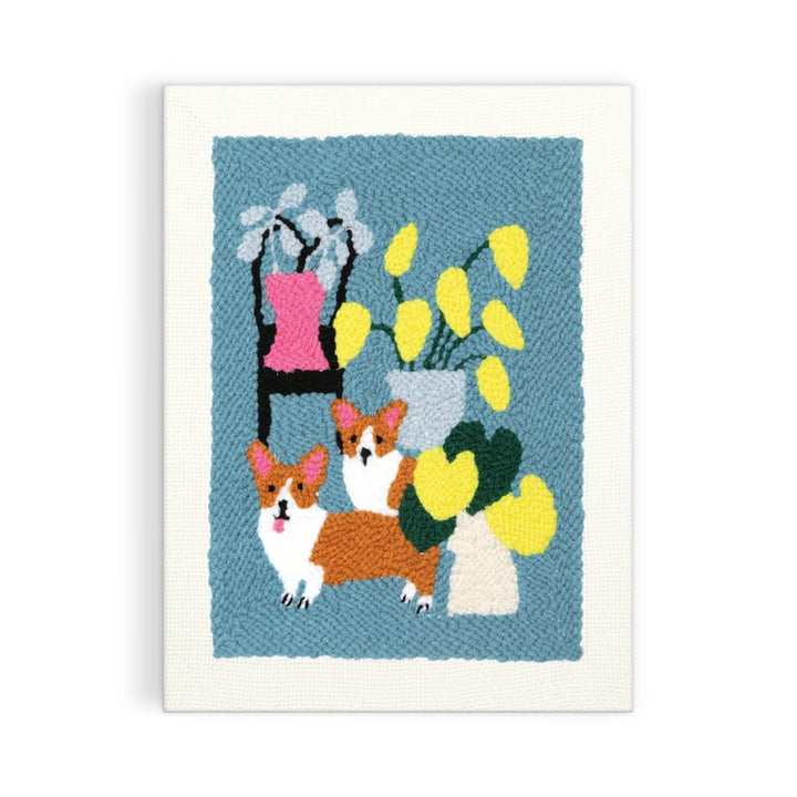 Corgi Friends Punch Needle Kit featuring a colorful punch needle design of two corgis with potted yellow and white flowers on a textured blue background, perfect for modern needlework enthusiasts.