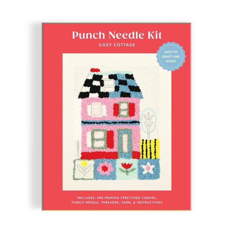 Cozy Cottage Punch Needle Kit featuring a colorful punch needle design of a two-story cottage with flowers and a tree on pre-printed stretched canvas, perfect for modern needlework enthusiasts.