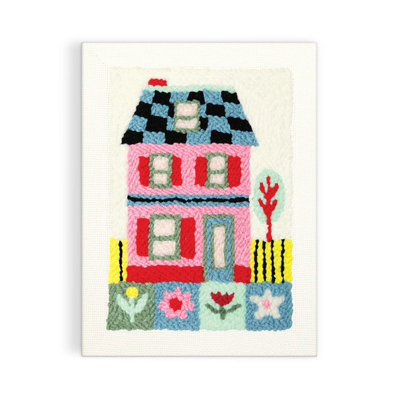 Cozy Cottage Punch Needle Kit featuring a colorful, textured house design crafted with soft embroidery thread on fabric, perfect for modern needlework and craft enthusiasts.
