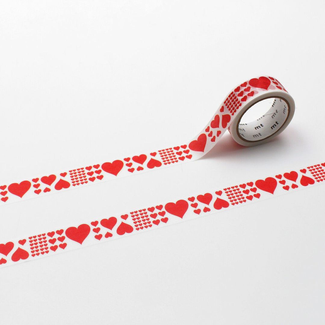 Washi tape with different size red hearts on white background