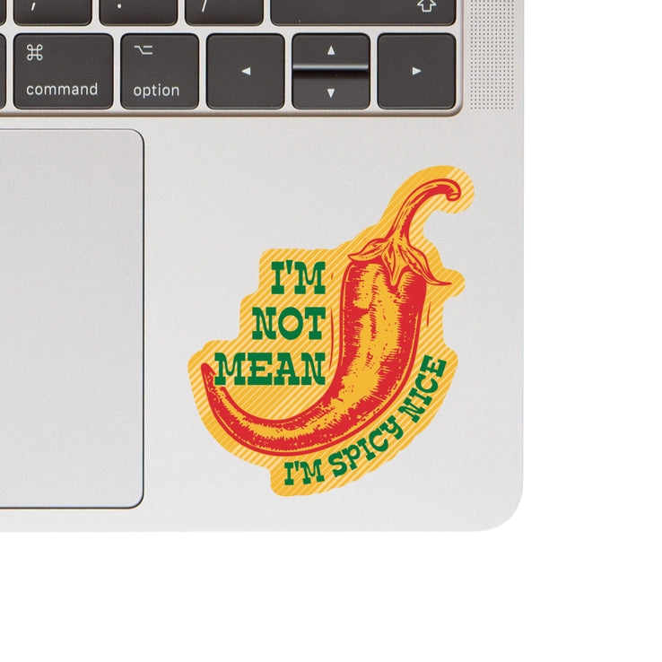 Spicy Nice Vinyl Sticker featuring a red chili pepper with the text "I'm not mean, I'm spicy nice" in green on a yellow striped background, perfect for decorating laptops.