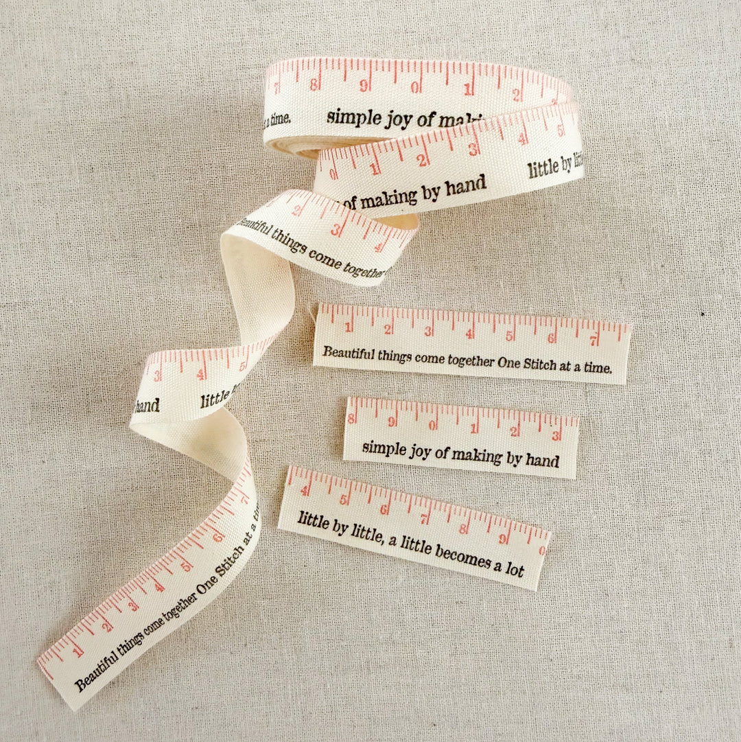 Measuring tape with printed text on a textured surface