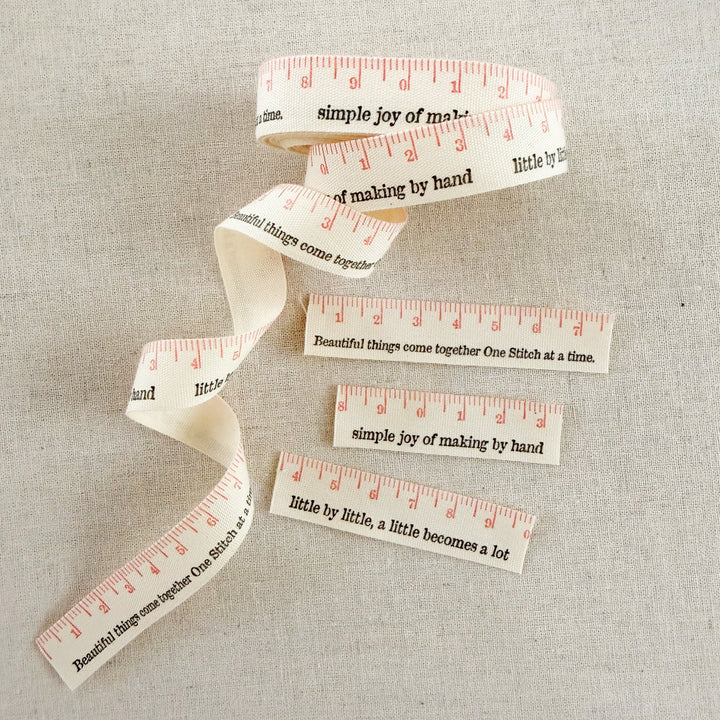 Measuring tape with printed text on a textured surface