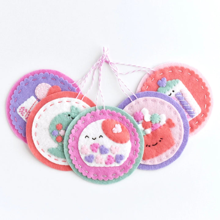 Sweetheart Shoppe Ornament Kit featuring five colorful felt ornaments with cute embroidered designs, perfect for modern needlework and hand embroidery enthusiasts.