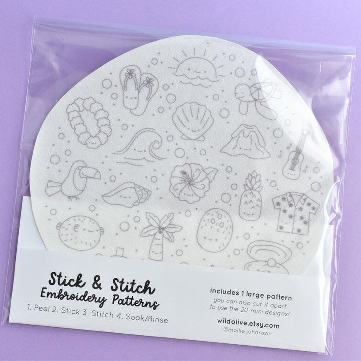 Packaged stick and stitch embroidery patterns on a purple background
