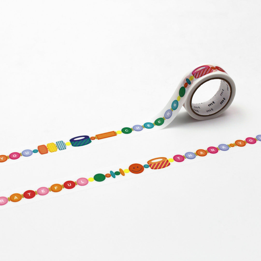 Japanese mt Washi Tape - Thank You featuring colorful round letters and cheerful icons, ideal for adding a playful touch to Japanese craft supplies and modern needlework projects.
