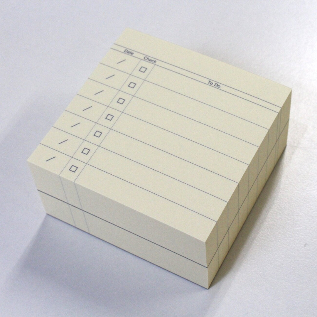 Stack of index cards with checkboxes on a white background