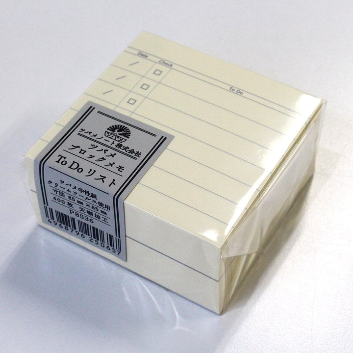 Stack of yellow sticky notes with a label on a white background