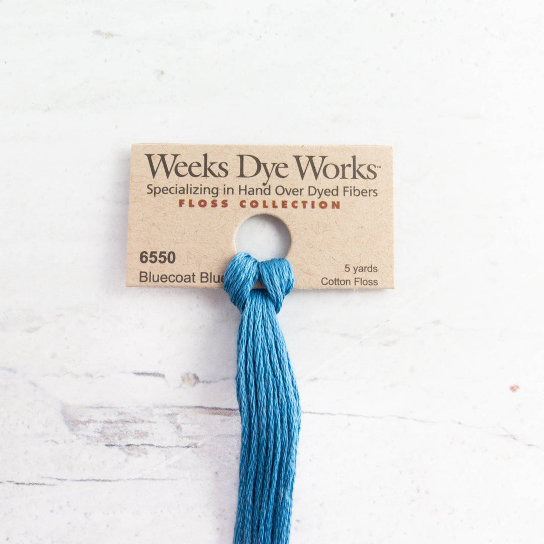 Weeks Dye Works Hand Over Dyed Embroidery Floss - Bluecoat Blue (6550) showing a vibrant blue cotton thread skein on a branded card, ideal for modern needlework and embroidery projects.