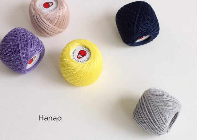 Daruma Home Thread #30 Ball Collections in pastel purple, yellow, beige, navy, and light gray, perfect for embroidery, cross stitch, and Japanese craft supplies enthusiasts.