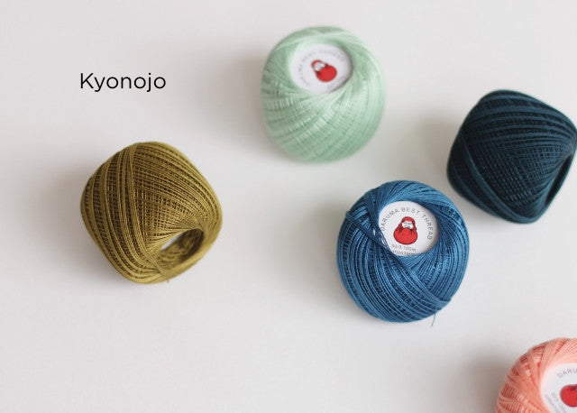 Assorted colored Daruma Home Thread #30 Ball Collections in green, blue, navy, olive, and coral shades, suitable for embroidery and Japanese craft supplies.
