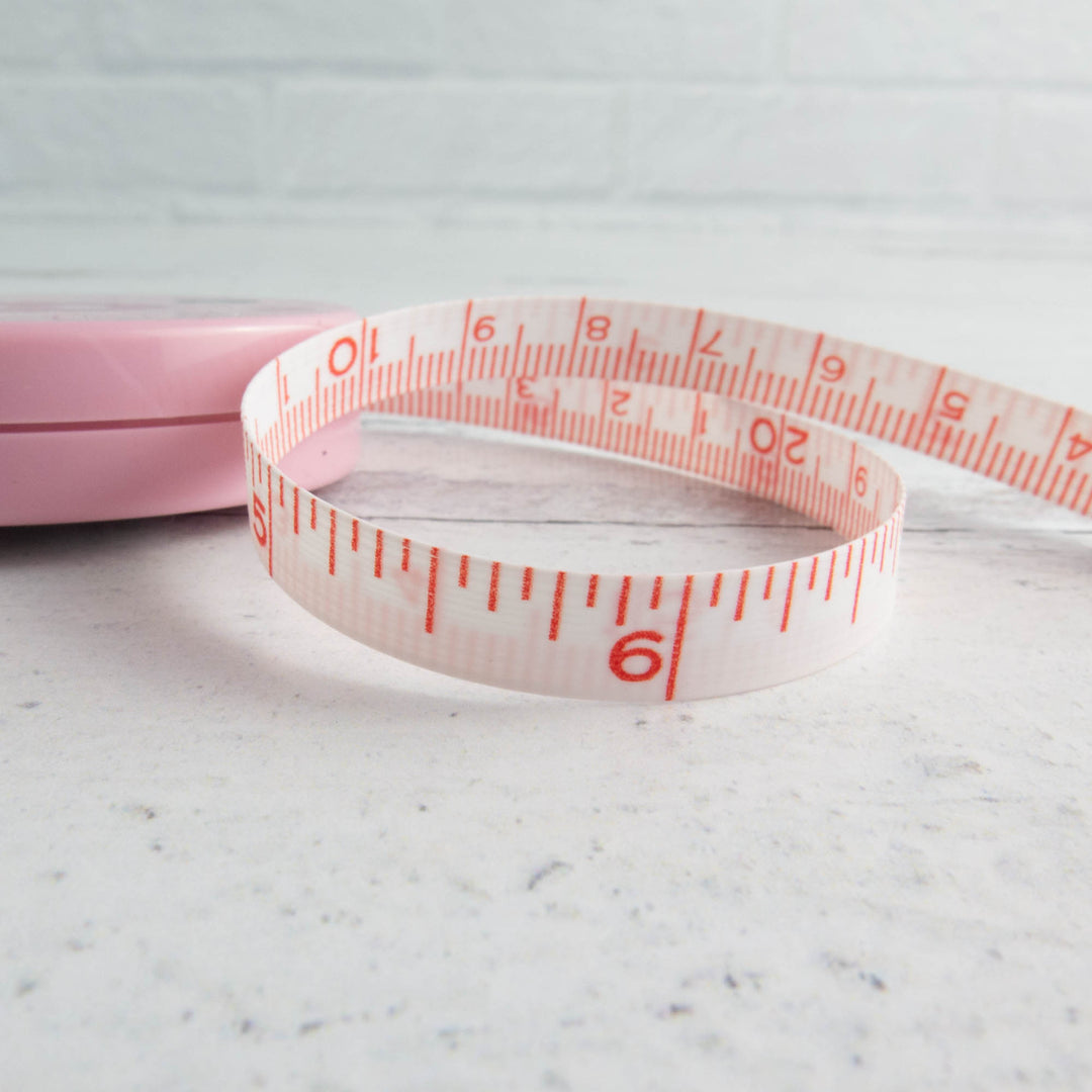 Adorable measuring tape print in 100% cotton made by Fabric